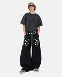 full-body outfit with black star graphic barrel sweatpants