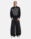 model front view wearing black waffle graphic long sleeve t shirt