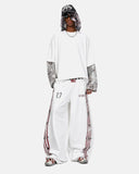 full-body outfit with white graphic barrel sweatpants