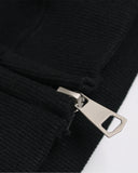 close-up of zipper pull and ribbed cuff detail