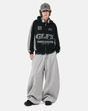 full body outfit with black graphic zip hoodie and grey pants