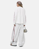 model back view in white embroidered long sleeve t shirt