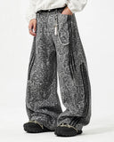 model wearing grey leopard side stripe barrel jeans