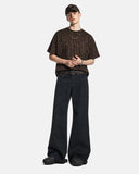 black bootcut jeans styled with streetwear outfit