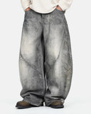 model wearing grey barrel jeans front view