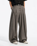 model side view in asymmetric button tailored pants