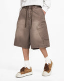 Male model wearing brown loose cargo jorts outfit