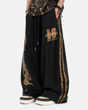 model wearing black leopard stripe barrel sweatpants