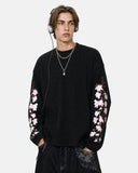 model front view wearing black floral embroidered long sleeve t shirt