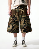 model front view wearing contrast stitch camo cargo longline shorts with relaxed fit