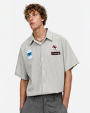striped button up shirt with front badge patches