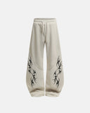 Front view beige tribal print baggy wide leg sweatpants