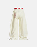 cream graphic sweatpants with striped waistband