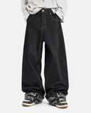 model wearing dark indigo baggy jeans front view