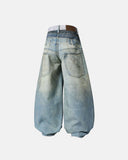 Barrel-leg jeans with layered waist and distressed details