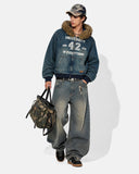 model wearing washed denim hooded jacket full-body streetwear look