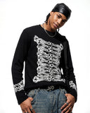 side view of lace up sleeve cuff detail on knit top