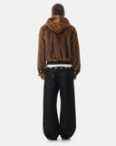 model wearing brown faux fur bomber jacket full-body back view