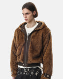 model wearing hooded faux fur bomber jacket side angle
