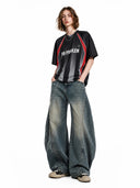model wearing curved seam barrel jeans